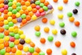 Colorful candy-decorated cake slices on white surface Royalty Free Stock Photo
