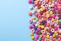 Colorful candy and donuts on blue background, AI Royalty Free Stock Photo
