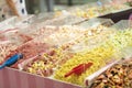 colorful candy, jelly sweets in plastic boxes on showcase in sweet-shop