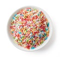 Colorful candy sprinkles in white bowl isolated on white, from a Royalty Free Stock Photo