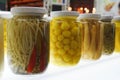 Colorful canned vegetables in glass pot. Food, preser