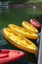 Colorful canoe anchored at pier in lake