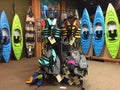 Colorful canoes and liftjackets for sale