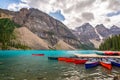 Colorful canoes on Moraine lakel near Lake Louise village in Banff National Park, Alberta, Rocky Mountains Canada Royalty Free Stock Photo