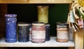 Colorful cans of paint on the shelf in the workshop Royalty Free Stock Photo