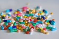 Colorful capsules, pills and tablets on white table Royalty Free Stock Photo