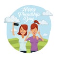 Colorful card of happy friendship day with pair of women outdoors in sunny day and one taking a selfie