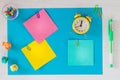 Colorful cards with space for an inscription, clock showing five minutes to twelve. office or business concept.