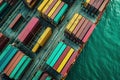 Colorful cargo containers on a dock, interconnected world of maritime shipping and distribution. Aerial view.
