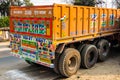 Colorful cargo truck with rich decorative paintings, typical for the trucks in India