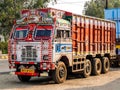 Colorful cargo truck with rich decorative paintings, typical for the trucks in India