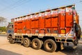 Colorful cargo truck with rich decorative paintings, typical for the trucks in India