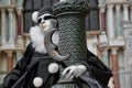 Colorful carnival black-white mask and costume at the traditional festival in Venice, Italy