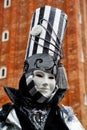 Colorful carnival black-white mask and costume at the traditional festival in Venice, Italy