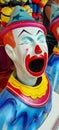 Colorful carnival clown with a large open mouth Royalty Free Stock Photo