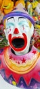 Colorful carnival clown with a large open mouth Royalty Free Stock Photo