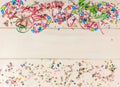 Carnival confetti and serpentines on white background, top niew Royalty Free Stock Photo