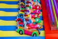 A colorful carnival game with little clown figures in cars at the Santa Monica Pier