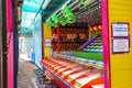 A colorful carnival game with stuffed animals handing on the walls at the Santa Monica Pier