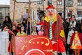 Colorful carnival parade down the street with clowns and jugglers in Zamora, Spain in February.