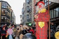 Colorful carnival parade down the street with clowns and jugglers in Zamora, Spain in February