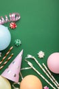 Colorful carnival or party frame of balloons, streamers and confetti on green background. Space for text Royalty Free Stock Photo