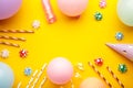 Colorful carnival or party frame of balloons, streamers and confetti on yellow background. Space for text Royalty Free Stock Photo