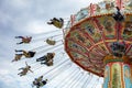 Carousel on cloudy sky background. Oktoberfest, Bavaria, Germany