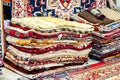 Colorful Carpets variety selection rolled up rugs shop store