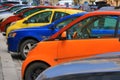 Colorful cars parked on the street, Yellow, blue, red, orange automobiles Royalty Free Stock Photo