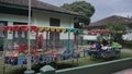 Colorful cart toys parking on the side of street in front of house