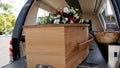 Colorful casket in a hearse or chapel before funeral or burial at cemetery