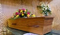 Colorful casket in a hearse or chapel before funeral or burial at cemetery