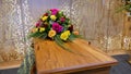 Colorful casket in a hearse or chapel before funeral or burial at cemetery