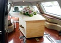 A colorful casket in a hearse or church before funeral