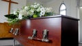 A colorful casket in a hearse before funeral