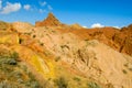 Colorful castle shape mountains, yellow and different color painted hills Royalty Free Stock Photo