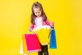 Colorful casual child girl isolated on yellow background Royalty Free Stock Photo