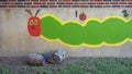 Colorful caterpillar painting outside Mount Auburn School in Dallas, Texas.