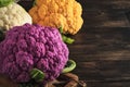 Colorful cauliflower. Various sort of cauliflower on old wooden background. Purple, yellow, white and green color cabbages. Brocco Royalty Free Stock Photo