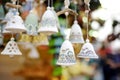 Colorful ceramic bells and other decorations sold on Christmas market in Riga