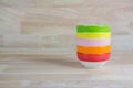 Colorful Ceramic Bowls Stacked On Each Other on Wood Background Royalty Free Stock Photo