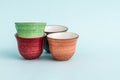 Colorful Ceramic Espresso Cups on Green Background