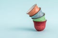 Colorful Ceramic Espresso Cups on Green Background