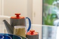 Colorful ceramic jars and cups on a table