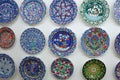 Colorful ceramic plates for sale in Turkey. Decorated tableware in the tourist store. souvenir shop