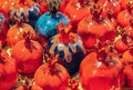 Colorful ceramic pomegranates displayed in rows Royalty Free Stock Photo