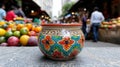 Colorful ceramic pot with floral pattern in front of fruit stall Royalty Free Stock Photo