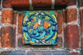 Colorful ceramic tile on a church facade. Royalty Free Stock Photo