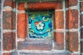 Colorful ceramic tile on a church facade. Royalty Free Stock Photo